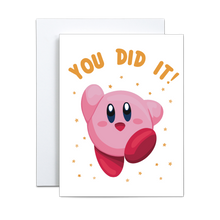 Load image into Gallery viewer, illustrated video game character kirby in the classic end of level pose with yellow stars surrounding with 'you did it' in kirby yellow font above greeting card