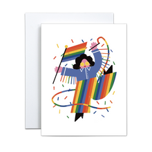 Load image into Gallery viewer, abstract and block shapes illustration of a person in a blue jacket with rainbow fringe and rainbow pants and black boots holding a rainbow pride flag and a rainbow streamer with rainbow confetti encircling on a white background greeting card