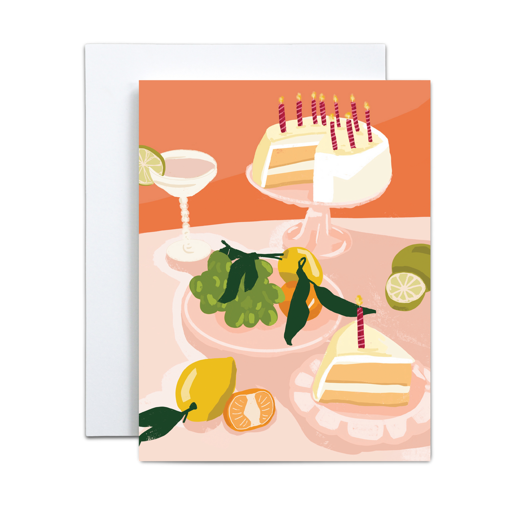 pink cake with candles and various citrus fruits and bubbly drink feast birthday greeting card