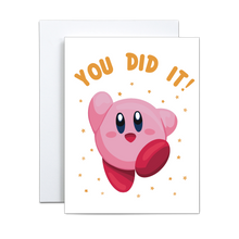 Load image into Gallery viewer, illustrated video game character kirby in the classic end of level pose with yellow stars surrounding with &#39;you did it&#39; in kirby yellow font above greeting card
