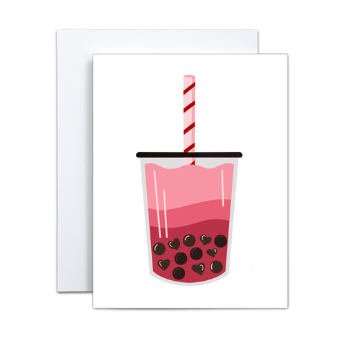 graphic design illustration of boba milk tea where the liquid is gradient shades of pink and the boba are heart shaped and regular shaped in a cup with a black lid and a light pink straw with red stripes on a white background greeting card