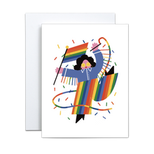 Load image into Gallery viewer, abstract and block shapes illustration of a person in a blue jacket with rainbow fringe and rainbow pants and black boots holding a rainbow pride flag and a rainbow streamer with rainbow confetti encircling on a white background greeting card
