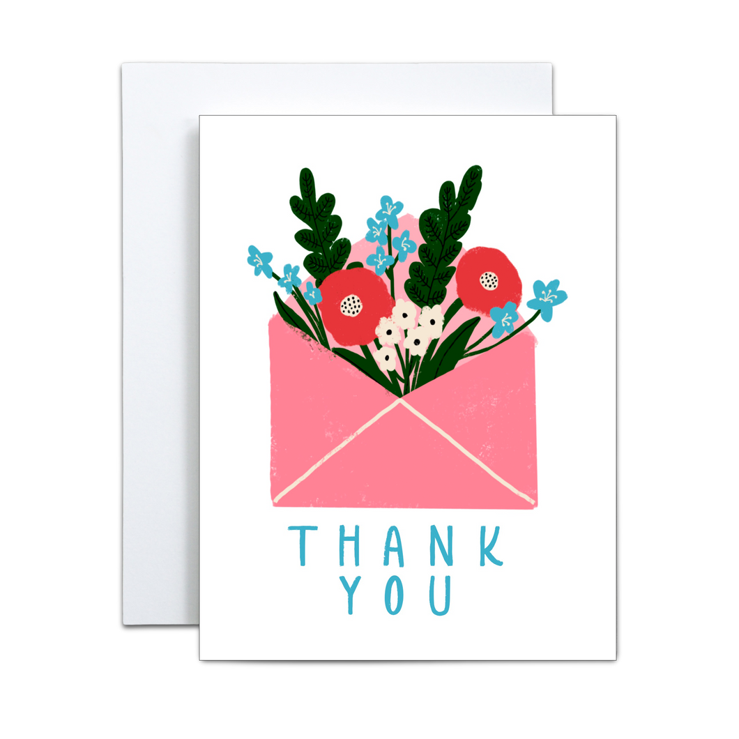 pink envelope with dark pink, white, and blue flowers and green foliage coming out with 'thank you' written in blue at the bottom greeting card