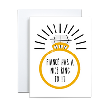 Load image into Gallery viewer, bold illustration of a gold wedding ring with a single large diamond with black lines for emphasis around the ring saying &#39;fiance has a nice ring to it&#39; in the center of the ring greeting card
